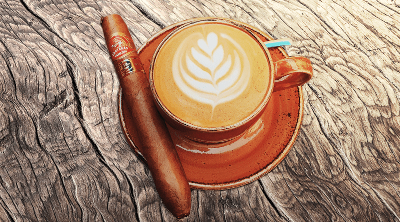na drevenom stole je káva a cigara partagas